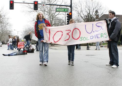 Protesters rally against the Iraq war at the corner of Wright and Green streets on Saturday. Erica Magda
