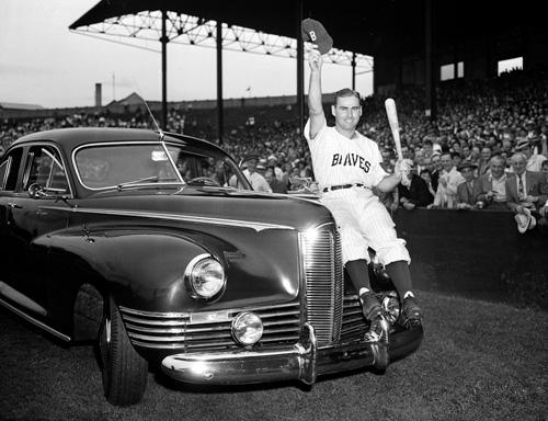 Boston Braves baseball outfielder Tommy Holmes waves from the automobile presented to him, as they celebrate the leading hitter with a Tommy Holmes Day, at Braves Field in Boston, Mass., in this Sept. 2, 1945 file photo. The Associated Press
