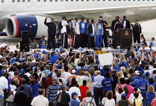 Members of the Memphis basketball team are welcomed at the Memphis, Tenn., airport on Tuesday. The Associated Press, Alan Spearman
