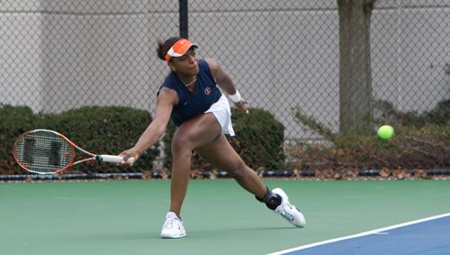 Sophomore Kristina Minor lunges toward a low ball during a doubles match against Iowa on Sunday in Urbana. Erica Magda
