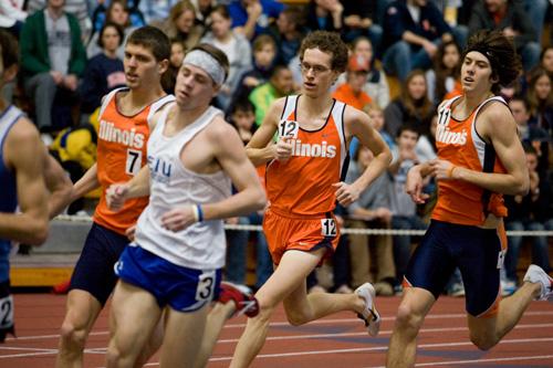 Illinois runners Trent Hoerr (left), Jacob Nachel (middle) and Dan Kremske (right) run past the crowd Jan. 26 at the Armory. Erica Magda
