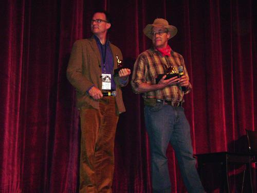 Director Taggart Siegel, left, and farmer John Peterson stand onstage after the well-received Ebertfest screening of The Real Dirt on Farmer John. The Daily Illini
