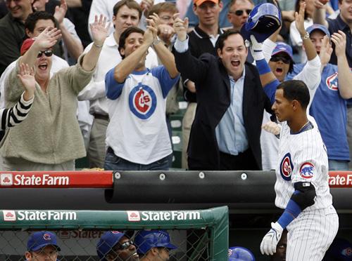 Chicago Cubs infielder Ronny Cedeno, right, acknowledges the fans after hitting a grand slam Tuesday against the New York Mets. The Cubs won 8-1. Nam Y. Huh, The Associated Press
