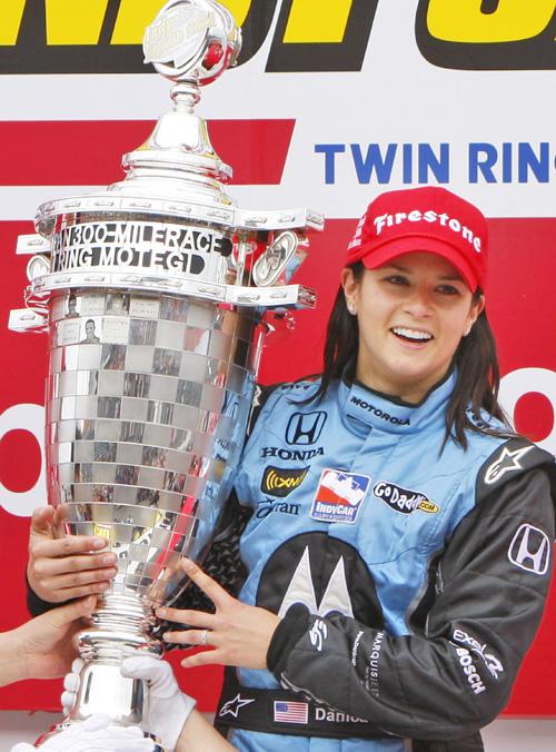 Danica Patrick shows off her trophy after winning the Indy Japan 300 race at Twin Ring Motegi on April 20. Shuji Kajiyama, The Associated Press
