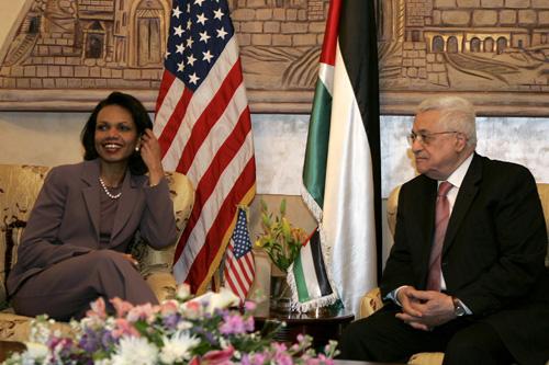 Secretary of State Condoleezza Rice, left, meets with Palestinian President Mahmoud Abbas, right, in Amman, Jordan, Monday. Rice says Mideast peace talks are moving in the right direction but urges Israel to stop new settlements Nader Daoud, The Associated Press

