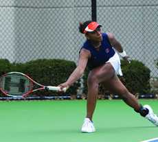 Kristina Minor reaches low for the ball during a doubles match against Iowa on April 20 in Urbana. Minor is set to return next year, as the Illini women hope to rank in the top 25. Steve Contorno
