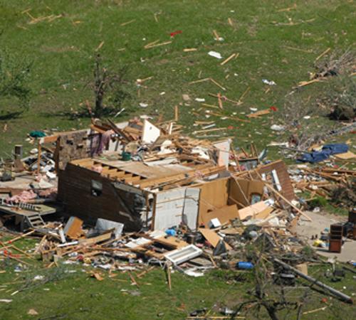 Residents clean up tornado damage on their home north of Seneca, Mo, on Monday, May 12, 2008. Missouri Governor Matt Blunt took an aerial tour of the affected areas in Missouri on Monday and held a press conference north of Seneca. Mike Gullett, The Associated Press
