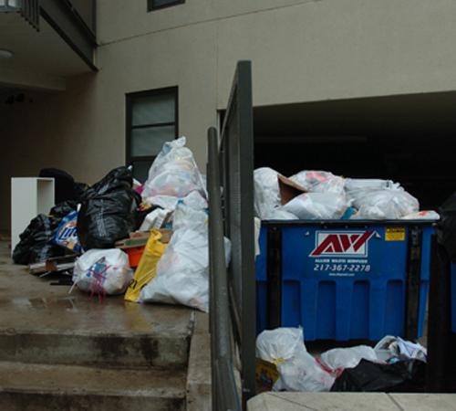 Garbage overflows from a dumpster of an apartment complex on Third and Healy streets on Sunday. Steve Contorno
