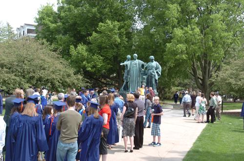 Students wait in line to take photos in front of the Alma Mater statue Saturday, May 10, 2008. While rain made the site less attractive Sunday, there was plenty of sunlight to take photos Saturday. Steve Contorno
