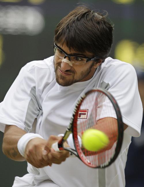 Janko Tipsarevic in action during his second round against Andy Roddick at Wimbledon on Thursday. Alastair Grant, The Associated Press
