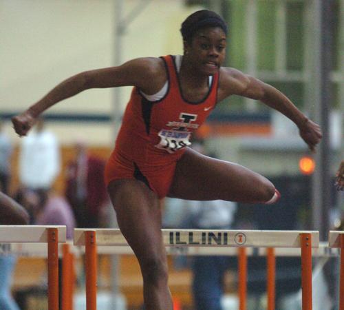 LaNeisha Waller leaps over the final hurdle of the 60 meter hurdles during the Big Ten Championships at the Armory, Sunday, February 25, 2007. Wes Anderson
