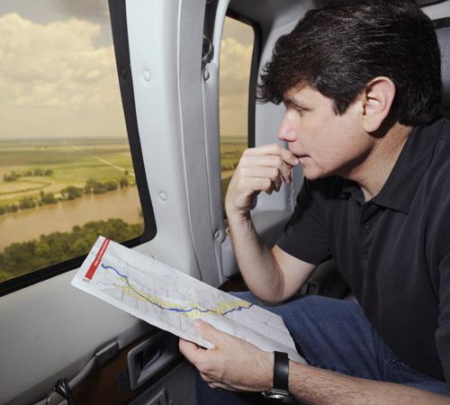 Illinois Gov. Rod Blagojevich looks from a helicopter over flood damage from the Mississippi River near Quincy, Ill., on Wednesday. Already weakened by impeachment talk, ongoing feuds with lawmakers, a federal investigation of his administration and the c Paul Beaty, The Associated Press
