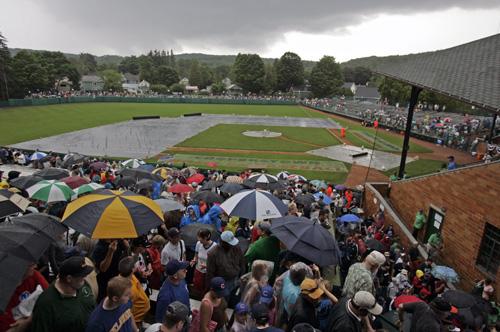 Baseball fans leave Doubleday Field as a thunderstorm cancelled the Hall of Fame Game in Cooperstown, N.Y., on Monday. The Chicago Cubs were scheduled to play the San Diego Padres in what was to be the final year of the exhibition game. Mike Groll, The Associated Press
