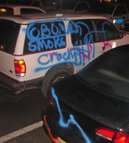 Some of the 60 city vehicles spray-painted by vandals while they were parked across from Orlando city hall late Saturday night. Investigators say the culprits spray-painted notes such as Obama smokes crack and a racial epithet. They also left Michael Lowe, The Associated Press
