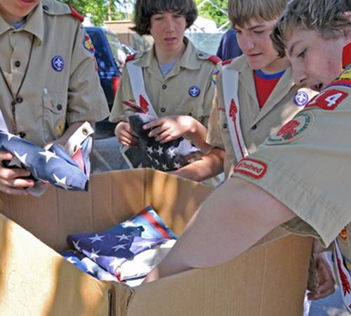 Boy Scouts from Illini Lodge 55 of the Order of the Arrow collect used flags at the Champaign Fire Department on Randolph Street on Saturday. The Scouts, in honor of Flag Day, held a community drive to collect used and worn out American flags, as well as Wes Anderson
