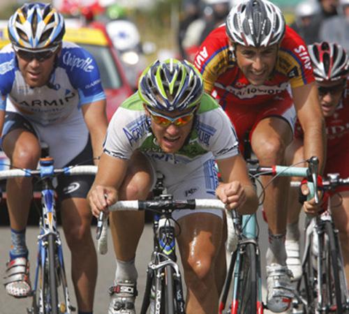 Riders in the breakaway group, William Frischkorn of the U.S., new overall leader Romain Feillu of France, Paolo Longo Borghini of Italy and stage winner Samuel Dumoulin of France, left to right, strain during the third stage of the Tour de France between The Associated Press
