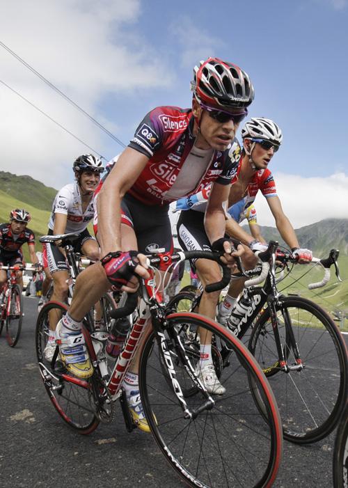 New overall leader Cadel Evans of Australia, center, climbs Tourmalet pass during the 10th stage of the Tour de France cycling race between Pau and Hautacam, southern France, on Monday. Right is Frank Schleck of Luxemburg who ranks second in the overall s Bas Czerwinski, The Associated Press
