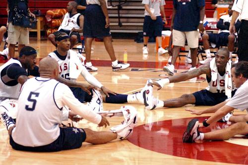 Team USA basketball players, from left, LeBron James, Jason Kidd (5), Carmelo Anthony and Kobe Bryant stretch after a practice session at Valley High School in Las Vegas on Monday. Team USA will try to win its first major championship since 2000. The Associated Press

