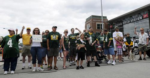 A large group of people show their support to bring back Green Bay Packers quarterback Brett Favre outside Lambeau Field in Green Bay, Wis., on Sunday. The rally was organized by brothers Adam and Erick Rolfson, and plan another on Monday night in suburb Evan Siegle, The Associated Press
