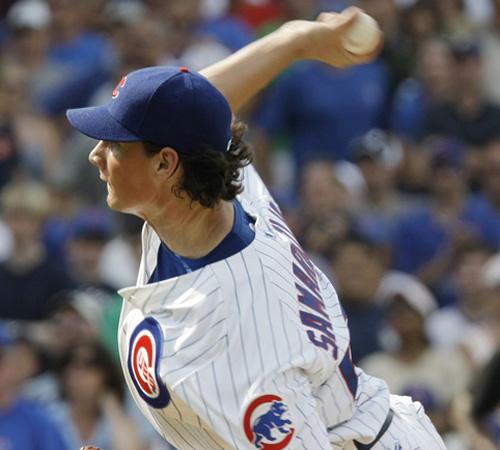 Cubs relief pitcher and former Notre Dame wide receiver Jeff Samardzija delivers during the ninth inning of their 9-6 win against the Florida Marlins at Wrigley Field in Chicago on Sunday. Samardzija notched his first career save in the game and has been Charles Rex Abrogast, The Associated Press
