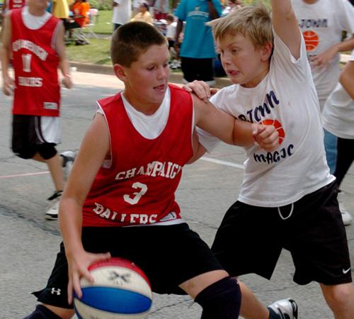 The Champaign Ballers and P-Town Magic compete in the semifinals of the Gus Macker 3-on-3 Basketball Tournament on Saturday. Wes Anderson
