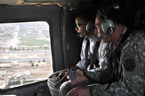 In this photo released by the U.S. army, U.S. presidential candidate Barack Obama, left, and top U.S. military commander in Iraq, David Petraeus, ride inside a helicopter in Baghdad, Iraq on Monday. Obama began his first on-the-ground inspection of Iraq s The Associated Press

