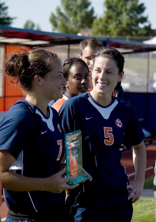 Emily Zurrer, center, alongside teammate Jackie Santacaterina, accept the trophy after the championship game of the Illini Challenge Cup at Illinois Track and Soccer Stadium, Sunday, Aug. 31, 2008. Illinois beat Dayton 1-0 in overtime with a header from Erica Magda
