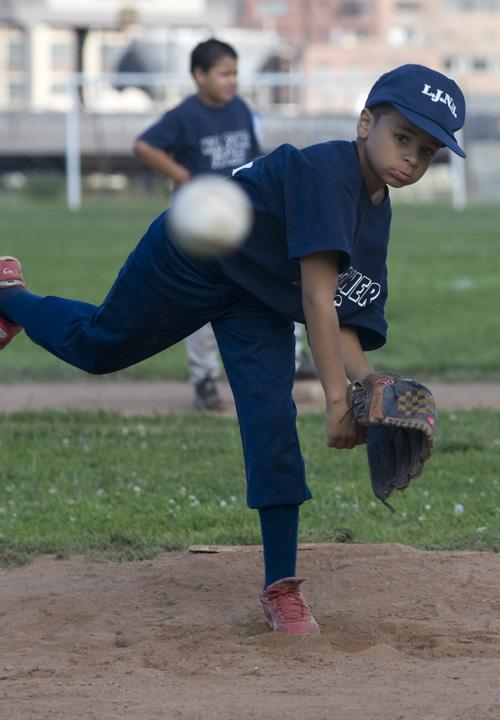 Jericho Scott, 9, warms up on the pitching mound in New Haven, Conn., on Saturday. He can pitch up to 40 mph. Douglas Healey, The Associated Press
