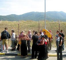 People line up and wait to have their passports stamped on the Georgian side of the Georgia-Armenia border during the evacuation on Aug. 11. Terrell Starr
