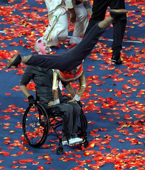Performers dance with an athlete during the closing ceremony of the 2008 Paralympic Games in Beijing on Wednesday. Andy Wong, The Associated Press

