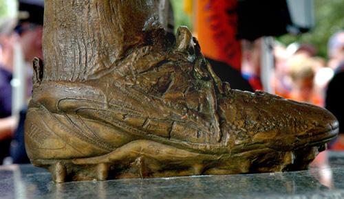 A view of the right shoe on the statue of former Syracuse University football great Ernie Davis during an unveiling ceremony on Saturday. The statue is historically inaccurate. Frank Ordonez, The Associated Press
