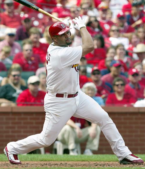 Albert Pujols bats in the fifth inning of an MLB game against the Florida Marlins on Sunday in St. Louis. Pujols is considering elbow surgery. Tom Gannam, The Associated Press
