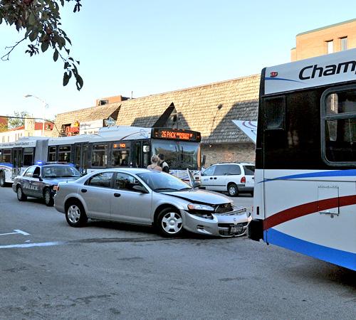 A 26 Pack bus negotiates around a crash involving a car and another MTD bus along Goodwin Avenue Tuesday evening. According to an eyewitness, the driver pulled up directly behind the bus and made impact with it. Patrick Wade
