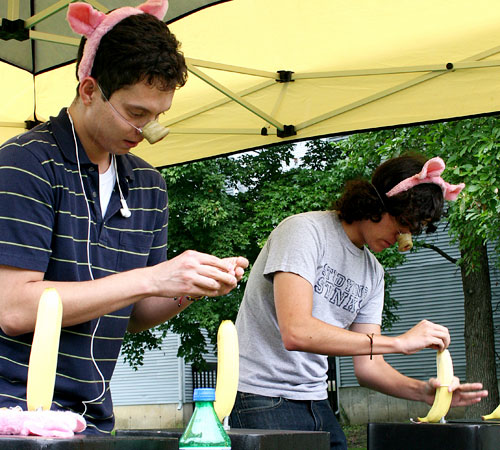 Javier Ospina (left), a Senior in Chemistry, and William Wood, Junior in LAS run the Condom Relay Race on Thursday, as part of t
