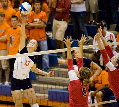 Illinois middle blocker Johannah Bangert takes a shot during the game against Southern Illinois University-Edwardsville at Huff Hall on Friday. The Illini brought new players on the court during the match. Erica Magda
