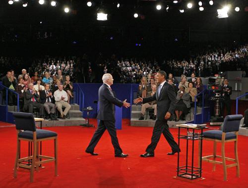 Sen. Barack Obama, D-Ill., right, and Sen. John McCain, R-Ariz., shake hands before the start of the town hall-style presidential debate Tuesday. Jim Bourg, The Associated Press
