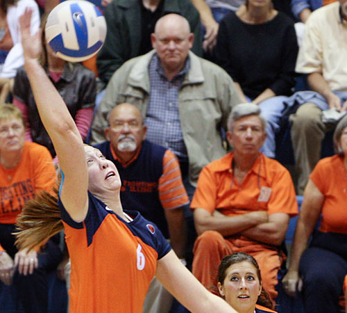 Freshman Ashley Edinger spikes the ball in the fourth set of a match against Iowa at Huff Hall on Saturday. The Illini won in four sets, 25-23, 25-17, 19-25, and 25-15. Erica Magda
