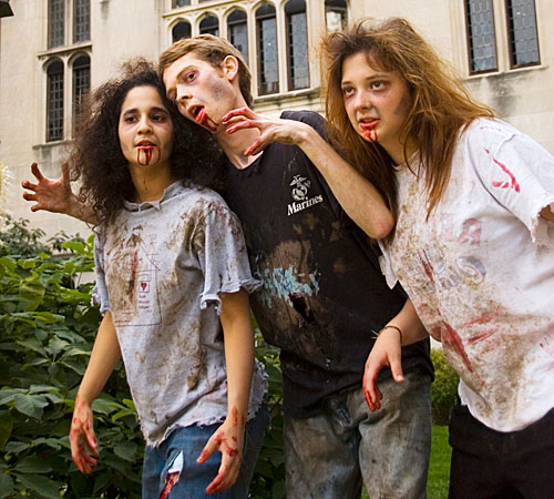 From left, Nory Reyes, freshman in AHS, Jarod Spohrer, junior in FAA, and Becky Long, sophomore in LAS, pose in front of the Wesley United Methodist Church in Urbana. Zombies and other creatures will roam the building later this month at the Wesley Haunte Erica Magda

