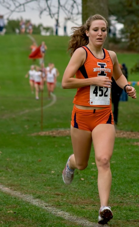 Amber Stack, a freshman, opens up a gap during the Illini Open, which was held at the Arboretum on Friday afternoon. Stack won the 5K race in a personal, season best time of 18 minutes 44 seconds. The team beat both Illinois State University and Northwest Erica Magda
