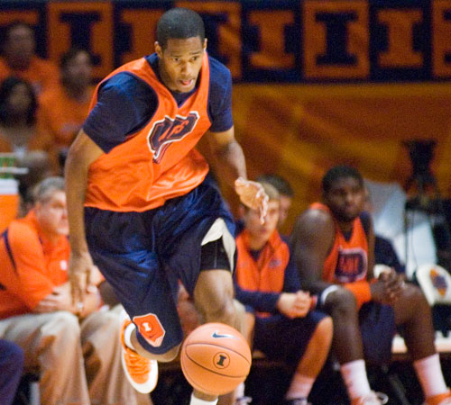 Illini forward Mike Davis dribbles the ball down the court at the Orange & Blue Scrimmage at Assembly Hall on Sunday. Davis is fighting for a starting spot at power forward. Erica Magda
