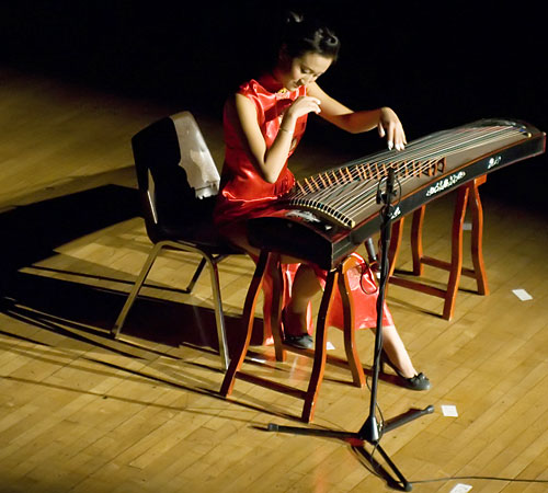 Ellen Li plays Bonfire Dance of the Yao People on a guzheng, a traditional Chinese instrument, at the Chinese Moon Festival Gala held on Saturday. Trevor Greene
