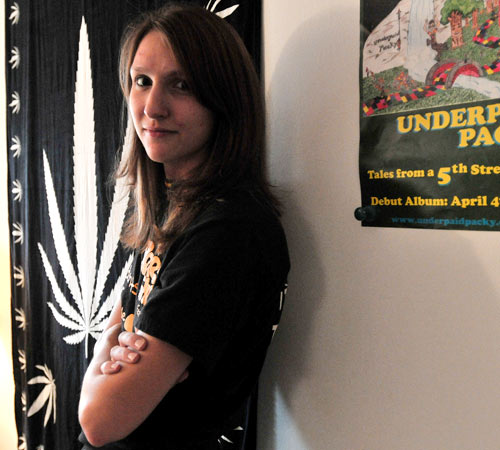 Laura Allured, sophomore in LAS and president of Students For Sensible Drug Policy, stands in her apartment in Urbana on Wednesday. The group will host three speakers tomorrow night to discuss Ibogaine legalization. Erica Magda
