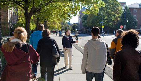 Alicia Wren, a Senior in Music Education, walks prospective students and their parents down Wright Street during a tour of campus on Tuesday. Erica Magda
