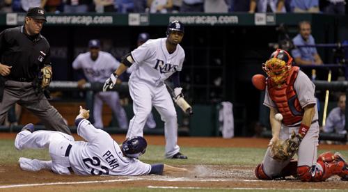 Tampa Bay Rays players congratulate each other after defeating the Boston Red Sox 9-1 in Game 3 of the American League Championship Series in Boston on Monday. Mark Humphrey, The Associated Press
