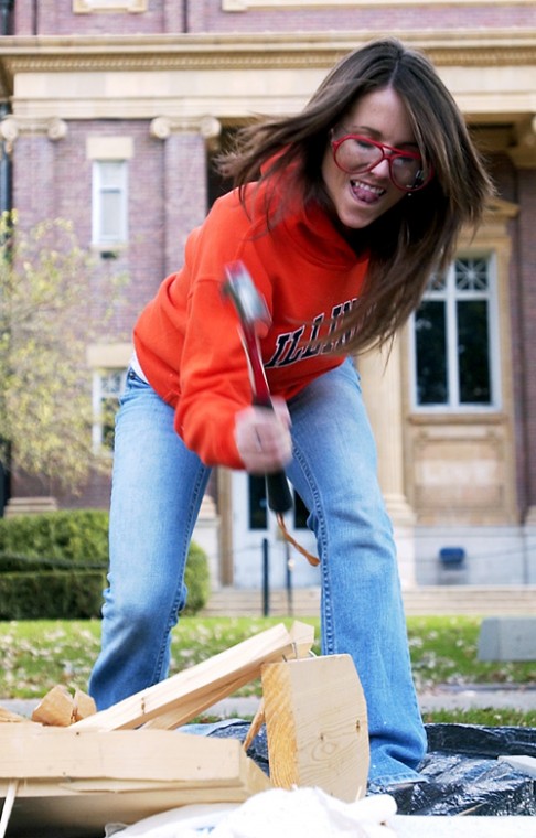 Colby Roate, freshman in LAS, hits a broken toolbox with a hammer at the Break Stuff booth Saturday. People are allowed to bring their own stuff, or use what is provided, as a way to let out their stress physically. Erica Magda
