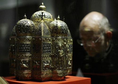 A man looks at a 12th century perfume brazier in the form of a domed building, from Constantinople or Italy, on display in the Byzantium 330-1453 exhibition at the Royal Academy of Arts in London, Tuesday, Oct. 21, 2008. Matt Dunham, The Associated Press
