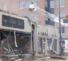 The historic Metropolitan Building in downtown Champaign is rubble after a fire early Friday morning. James VandeBerg
