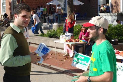 State House candidate Frank Calabrese, left, chats with Mark Mallon, right, senior in LAS. Mallon was campaigning for the Green Party while Calabrese was drumming up some last-minute support for his bid for the 103rd District. Brennan Caughron
