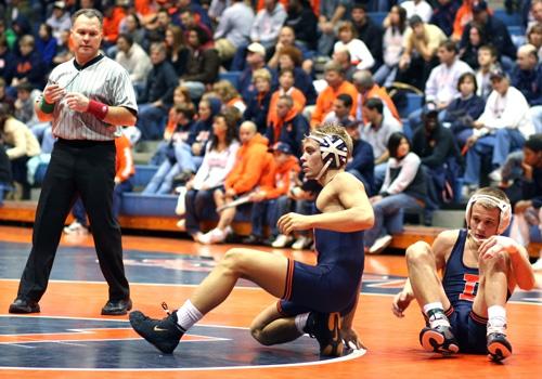 Sophomore wrestler Ryan Prater (right) in his bout against freshman Vince Vercelli (left) at 141 pounds in Huff Hall on Nov. 8. Erica Magda
