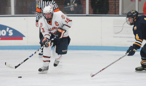 Illinois senior Jordan Pringle controls the puck against Michigan-Dearborn at the Ice Arena on Nov. 15. This weekend the hockey club plays Eastern Michigan at home Friday and Saturday hoping to close the semester on a winning note. Brennan Caughron
